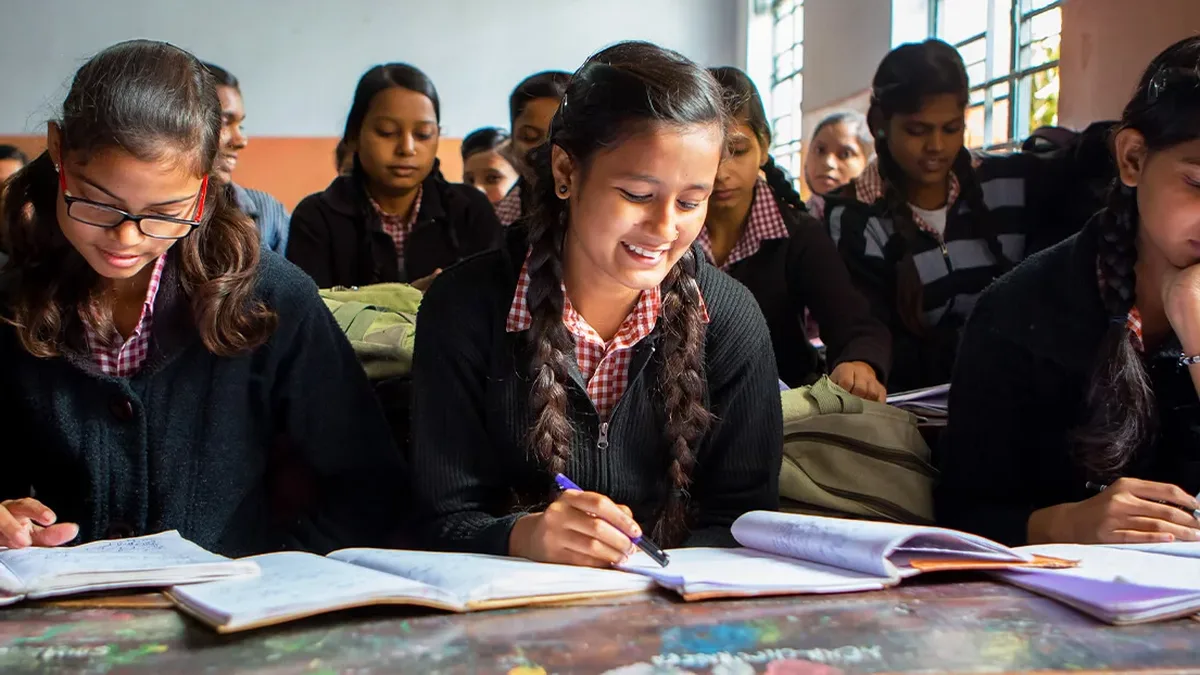 Indian girl students studying in a classroom