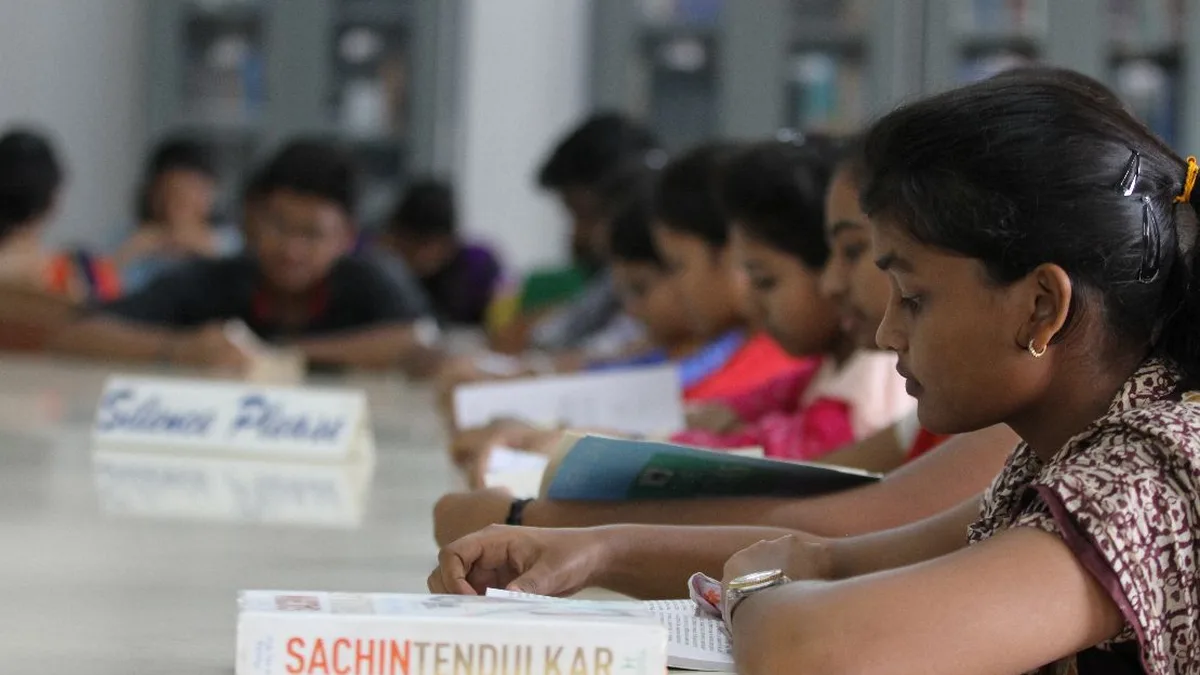Indian students studying in a university library with books