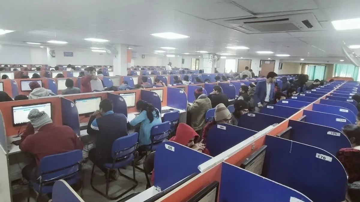 Candidates taking a computer-based entrance exam at an Indian test centre