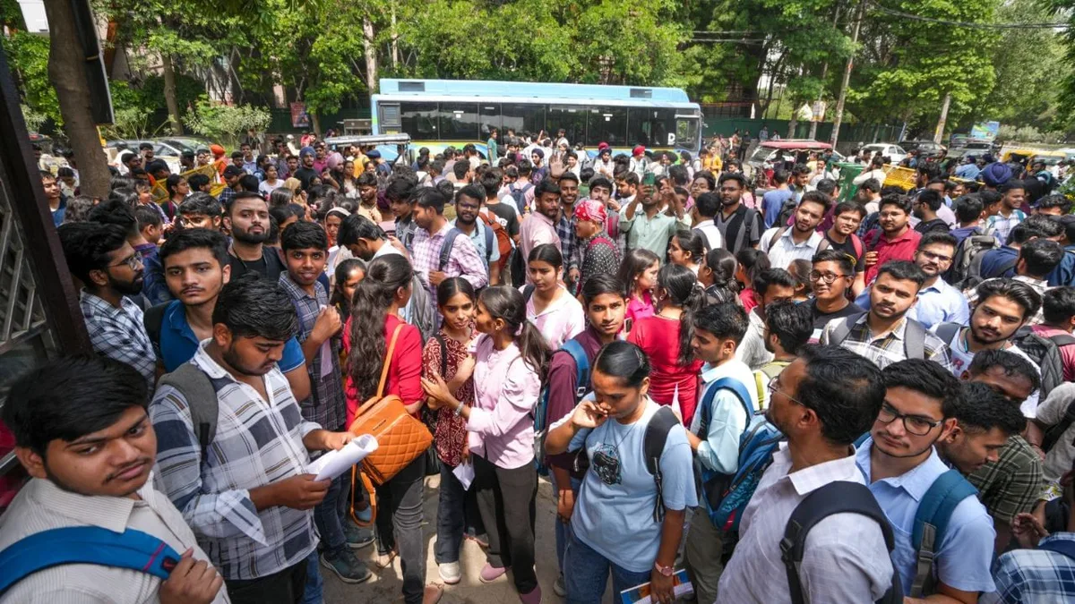 Indian college students crowding outside a college gate during the admission season