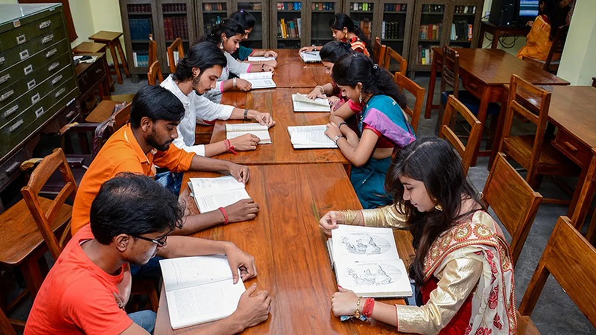 Indian college students studying together in a university library