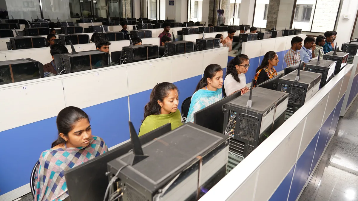Indian college students working at computers in a campus computer centre
