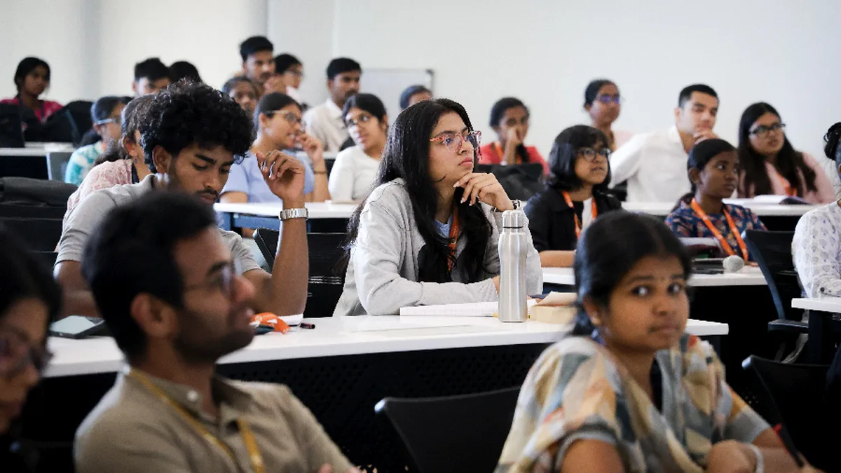 Postgraduate students attending a lecture at a Karnataka college during admission season