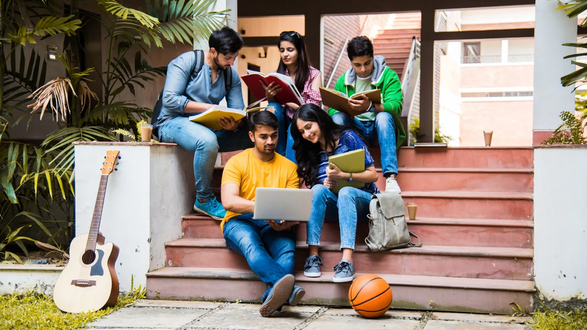 College students in India preparing for classes on a campus staircase