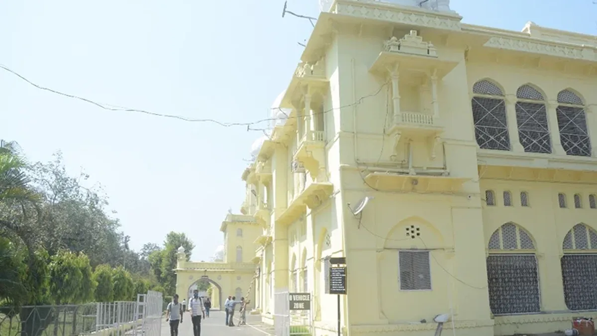 University building of Lucknow University with students on campus