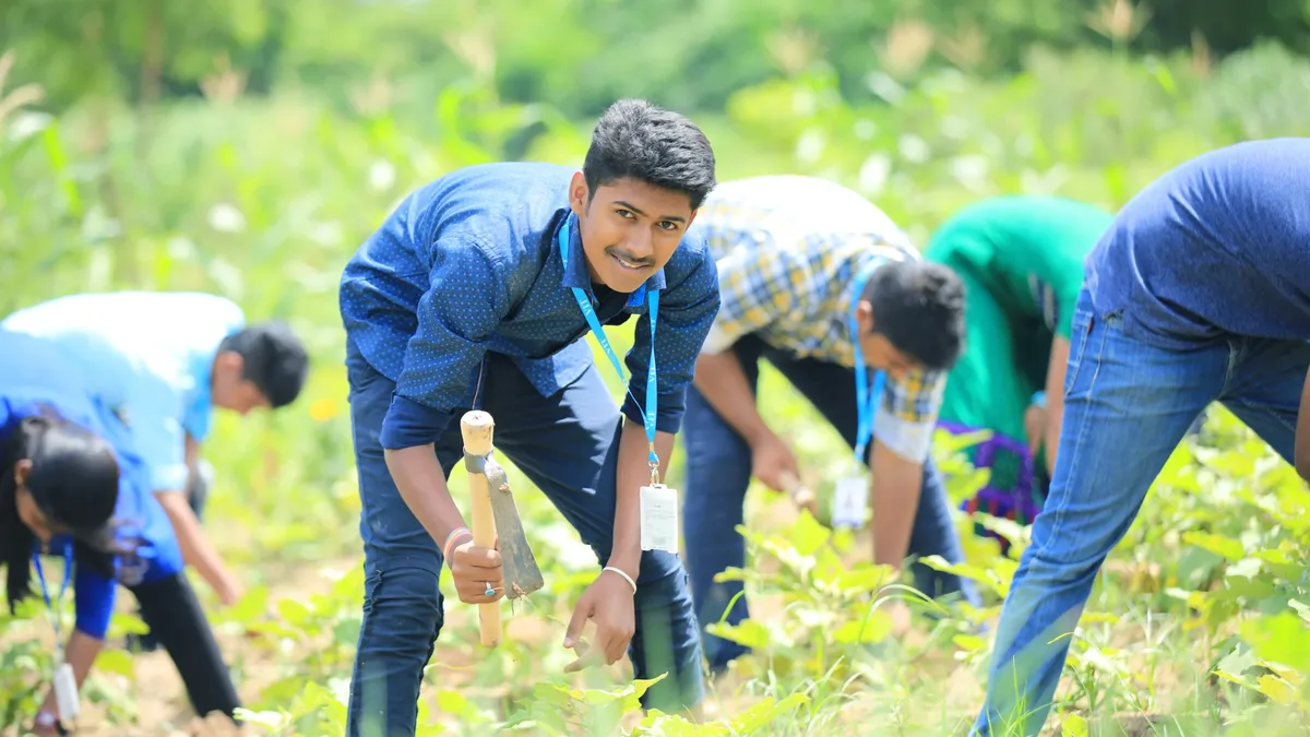 Agriculture students doing fieldwork at a college farm in India