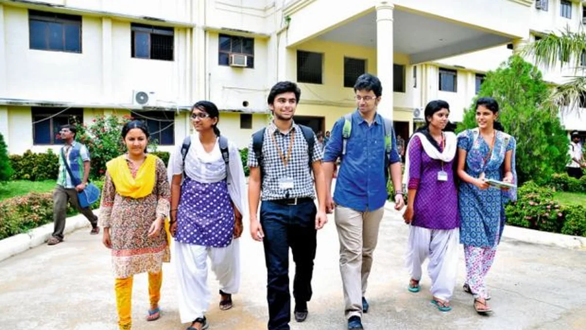 College students walking outside their campus building during admission season in India