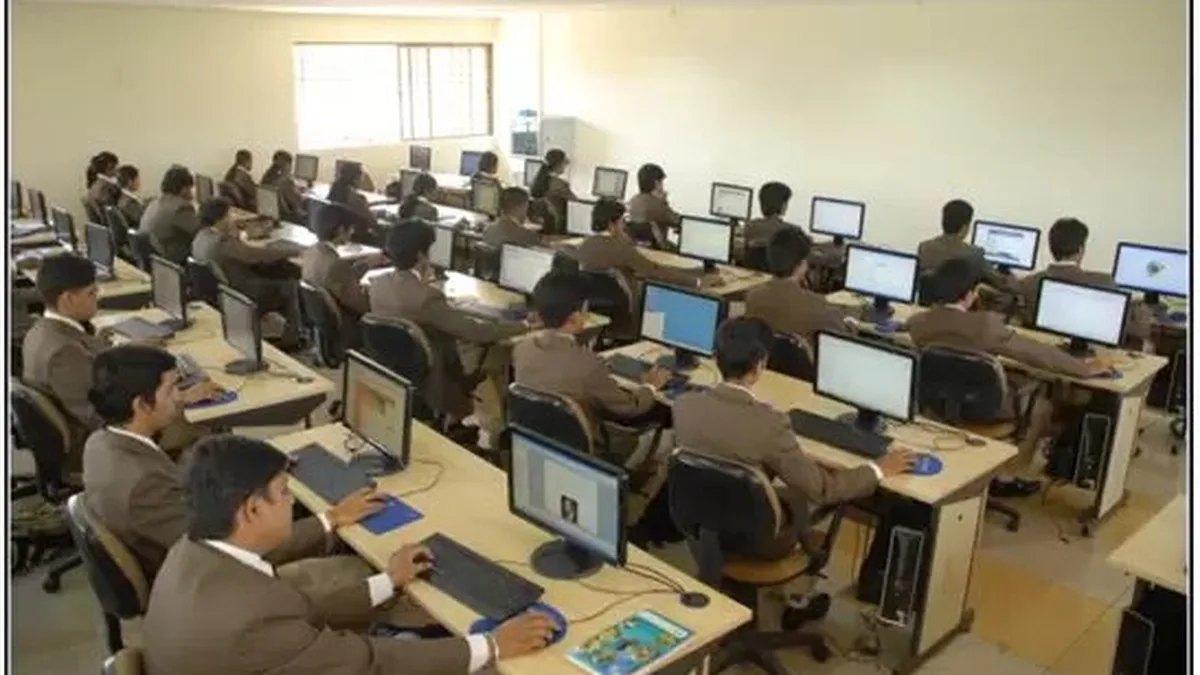 Students taking a computer-based test in a college computer lab