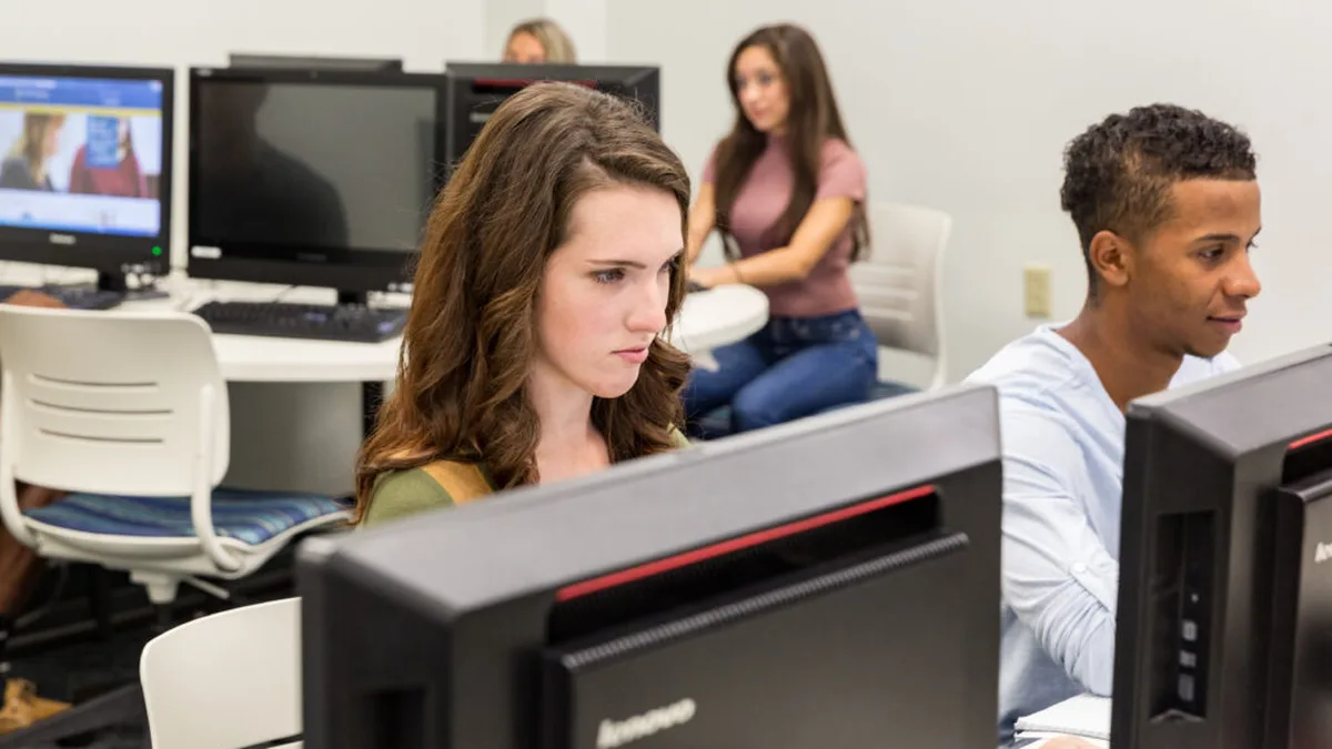 Engineering students working on computers in a college computer lab