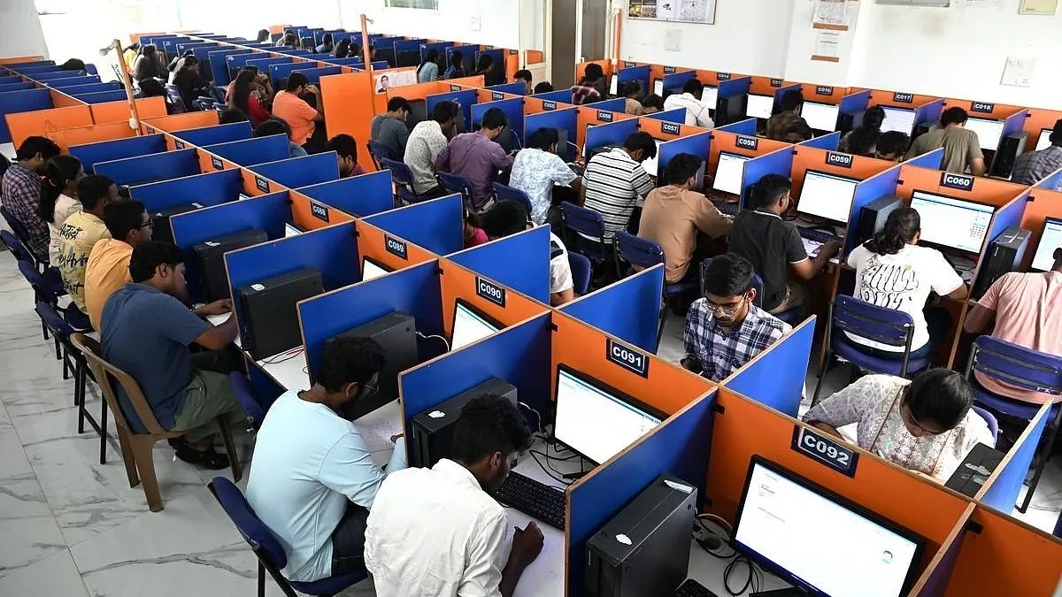 Candidates writing a computer-based exam at a test centre in India