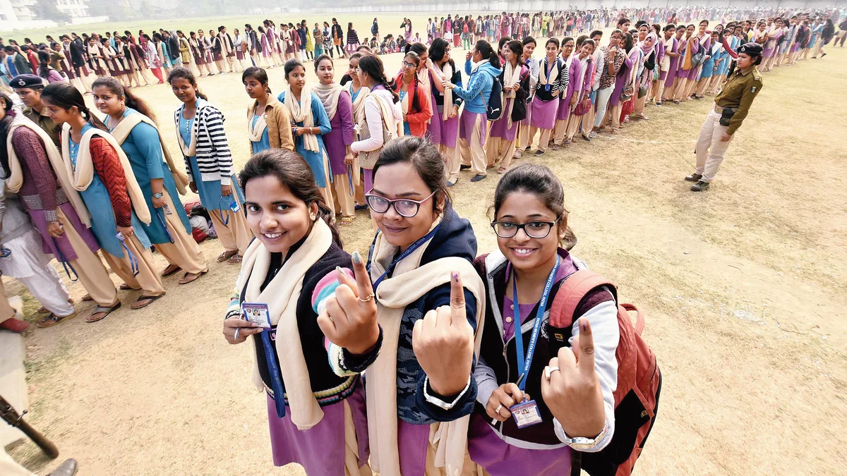 Students showing inked fingers in a long voting queue during a student union election in India