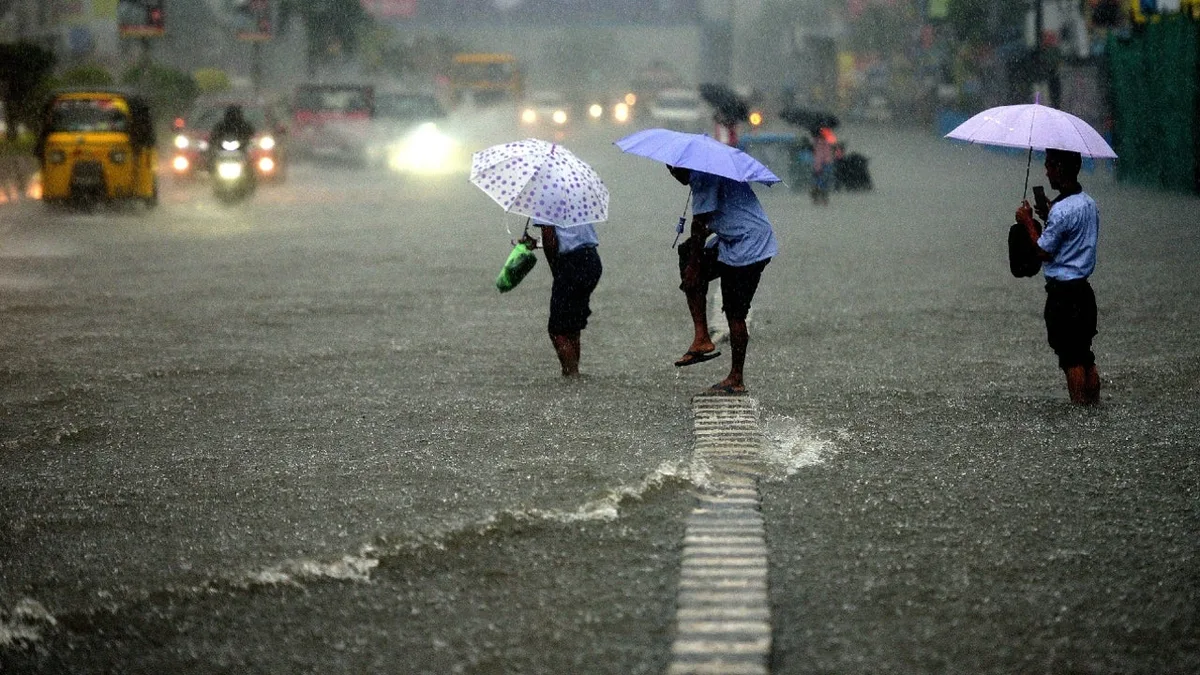 Heavy monsoon rain in a Chennai street during a school holiday in Tamil Nadu
